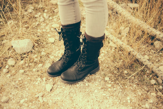 a person wearing black boots